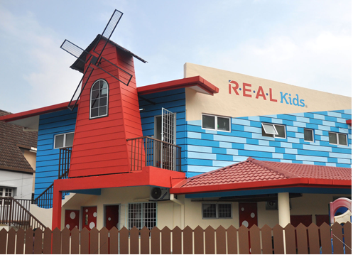 R.E.A.L Kids Kg Tunku No 20 business logo picture